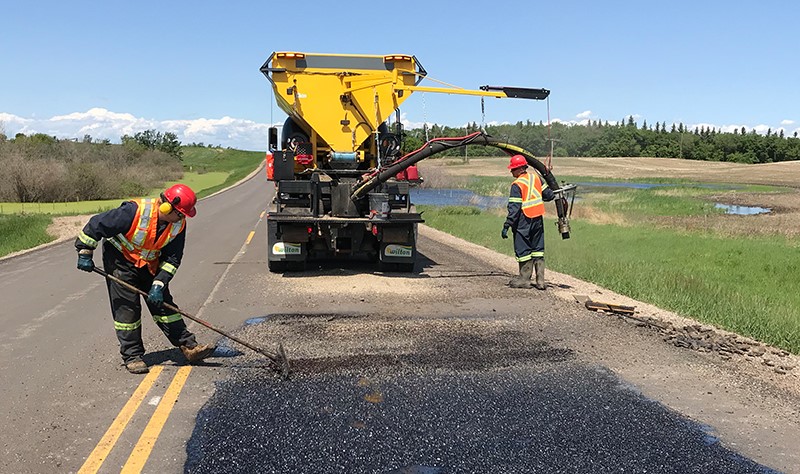 two-construction-workers-repairing-roads