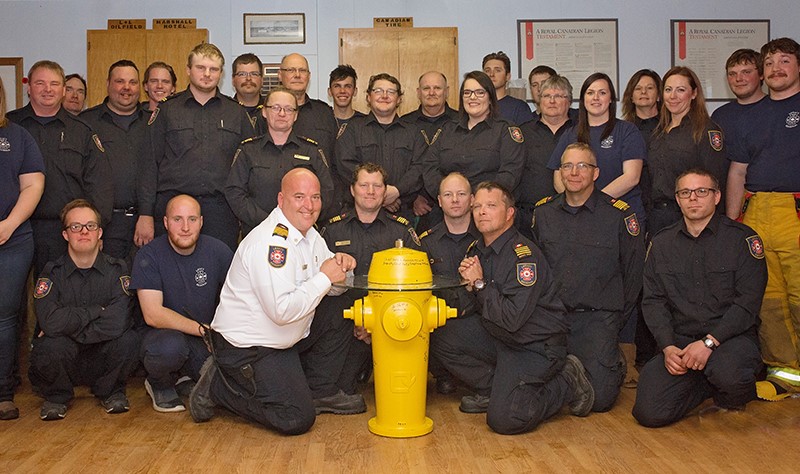 public safety workers in front of hydrant